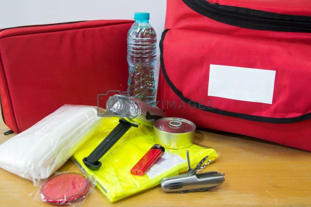 Filling emergency kit with things to help your family in crisis situations.