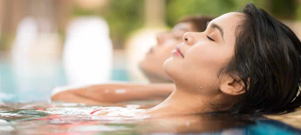 people relaxing in a spa pool