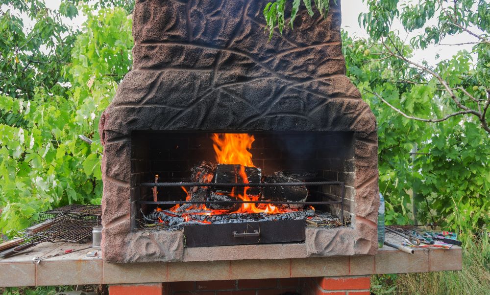 outdoor fireplace with fire going