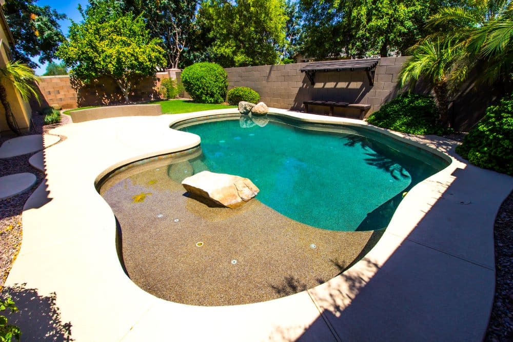 concrete pool outdoor living area