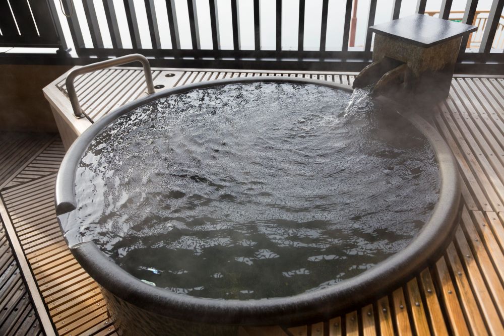 spa pool with wooden wrap around deck